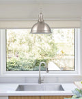 14 Inch Modern Industrial Pendant Light With Dome Shade In Brushed Nickel Finish installed over a kitchen sink with window view
