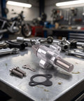 Top Shelf Aluminum Cam Chain Tensioner With Manual Tune Up For CBR600RR 2003 2018 on garage workbench with bolts.