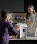 Man operating Chewable Nugget Ice Maker Countertop 35 Lbs Per Day Portable Sonic Ice Machine With Self Cleaning and One Click Operation