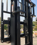 Close-up of Electric Pallet Stacker Heavy Duty Forklift 1 To 3 Ton Capacity showing hydraulic lift mechanism and frame.