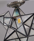 12 Inch Moravian Star Tiffany Style Stained Glass Semi Flush Mount Ceiling Fixture with Iridescent Glass, close-up view.