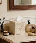 Heavy Resin Tissue Box Cover With Travertine Texture For Home Decor on bathroom countertop with toiletries.