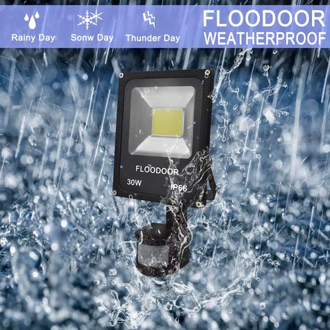 Ultra Bright Outdoor LED Motion Sensor Flood Light 12-24V AC/DC waterproof security lamp in heavy rain showcasing weatherproof feature