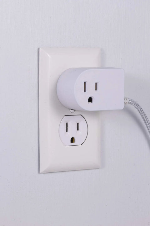 Braided Extension Cord With On Off Switch, 6 Ft Power Cable With 3 Prong Plug, Slip Resistant Base, Tabletop Or Wall Mountable, Tangle Free And Plug And Play Ready For Lamps And Holiday Lights, White And Gray 41095 plugged into wall outlet