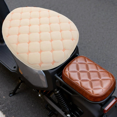 Hella Cozy Beige Plush Motorcycle Seat Cover With Super Warm Winter Fluffy Padding For Riders Seeking A Smooth Ride and Dope Dirt Bike Accessories That Look Clean And Feel Amazing All Day Long, showing quilted beige padding on a bike.