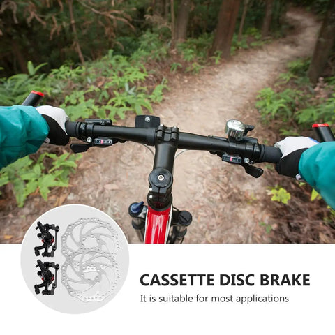 Complete Mechanical Disc Brake Set For Mountain Bikes Featuring Front And Rear 160 Mm Silver Aluminum Rotors with handlebars in a forest.