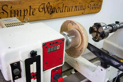 American Made Vacuum Chuck for Wood Turning Lathe With 1 Inch By 8 TPI Threads CNC Machined Aluminum, mounted on lathe with wood
