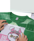 Pro T Shirt Ruler Guide For Easy Accurate Alignment Of Vinyl And Sublimation Designs On Shirts With Built In Size Chart For Hassle Free HTV Pressing And Perfect Placement Every Time on green T-shirt.