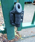 Close-up of 2 Pack Weatherproof Gate Hinges with Safe Spring Mechanism attached to green metal fence with no brainer install
