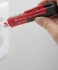 Heavy Duty Non Contact Ac Voltage Detector With Dead Nuts Accurate Dual Ranges detecting a wall outlet, showcasing its dual range feature.