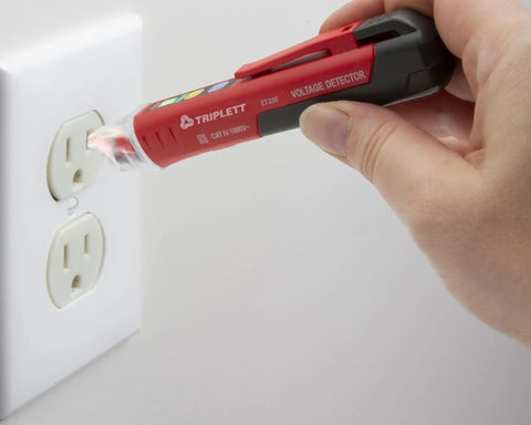 Heavy Duty Non Contact Ac Voltage Detector With Dead Nuts Accurate Dual Ranges detecting a wall outlet, showcasing its dual range feature.
