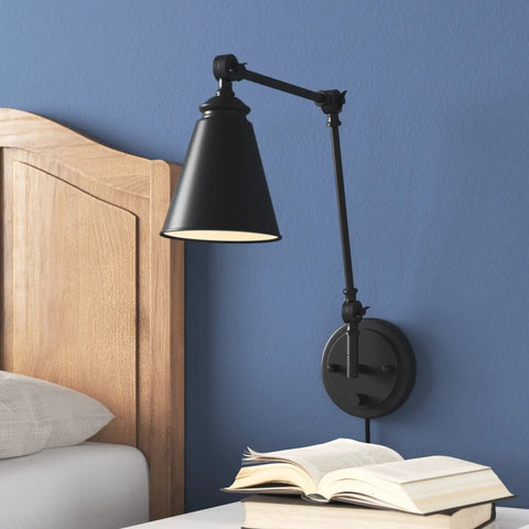 Vintage Adjustable Swing Arm Wall Lamp Black Dope Industrial Style Wall Sconce With Plug In Or Hardwired On Off Switch Ideal For Desk Or Bedside Reading Light, shown mounted beside a bed.