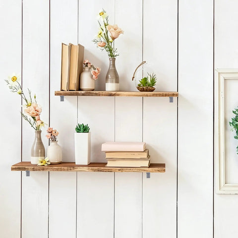 Decorative wooden shelves with books and vases, secured with Gray Furniture Anti Tip Anchors 12 Pack For Wall Attachment.