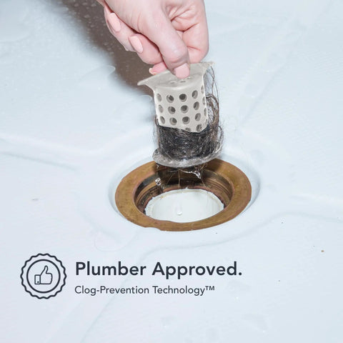 Big Time Win For Your Bathroom Two Inch Stand Up Shower Drain Protector Hair Catcher Strainer Gray Clog Guardian retrieving hair catcher from drain.