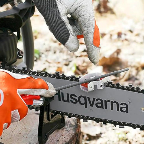 Person using X Cut S93G Chainsaw File Kit For Three Eighths Inch Mini Pitch Chainsaw Chains Heavy Duty Sharpening With Handle on saw