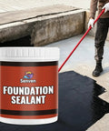 Premium Top Shelf Rubber Silicone Foundation Sealant Black 35 Oz Tub being applied to a damp concrete surface.