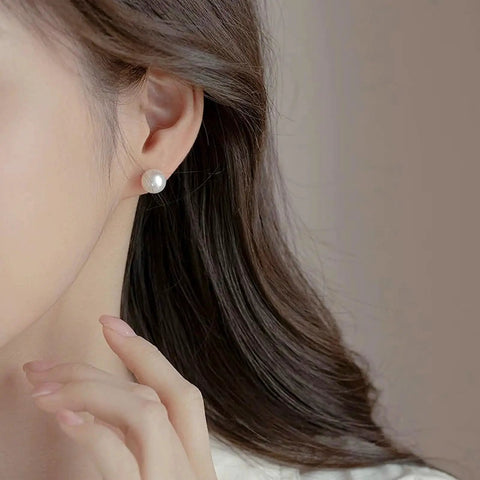 12 Pairs Hypoallergenic Stainless Steel Pearl Stud Earrings For Women Comfortable All Day Wear No Irritation Sensitive Ears Easy Everyday Bling For Work Parties And Gifts white pearl stud earring worn close-up