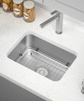 Heavy Duty Stainless Steel Kitchen Sink Grid With Centered Drain And Rounded Corners in a modern kitchen sink.