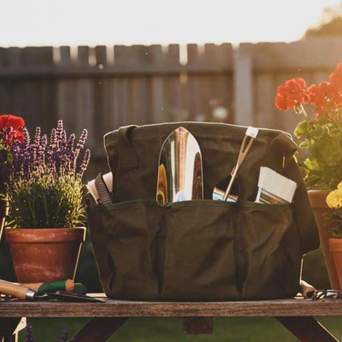Tough As Nails Heavy Duty Self Standing Tool Bag With Eight Pockets and Slick Organization For Garden Work, filled with tools.