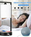 Modern White Table Lamps Set Of 2 With Touch Control, 3 Way Dimming, USB Charging Port And Wireless Charging Pad, E26 LED Bulbs Included, Bedside Nightstand Lamps For Bedroom Or Living Room, Sleek End Table Lighting next to a sleeping woman and a smart speaker.