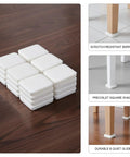 Eight Pack White Square Furniture Leg Pads 1.18 Inch PVC Floor Protectors stacked on wooden floor