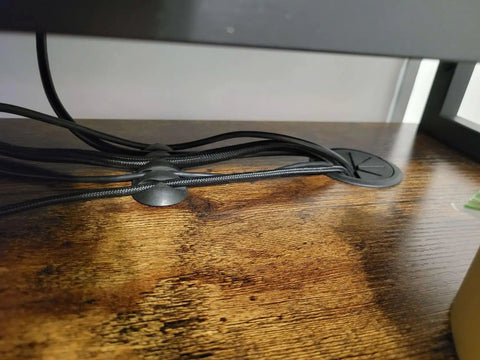 16 Pack Black Cable Clip Organizer Set with Adhesive Backing installed on wood desk, managing cords and USB cables neatly.