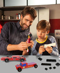 Father and son assembling Pinewood Derby cars with Pinewood Derby Weights Kit 5Oz With Tungsten Putty And 12 Derby Weights