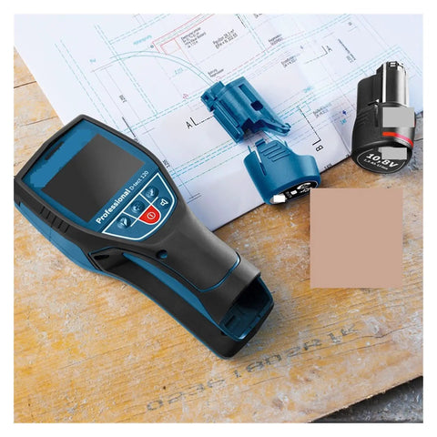 Heavy Duty Stud Finder Wall Scanner With Slick Visual Center Marker Detects Metal Wood Water Pipes Live Cables And Electrical Wires Dual Power Setup For Tight Spaces Zero Sweat Operation on a wooden surface with plans.