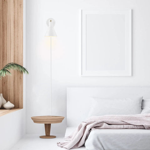 Dope Lofty Chic Modern Matte White Wall Sconce With Brass Accent 1 Light Plug-In Or Hardwire beside a white framed artwork