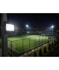 SODEF 50W LED Floodlight White Light IP65 Water-Resistant Outdoor High Lumen Energy Saving illuminating a night soccer field.