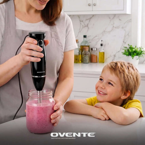 Straight Up Top Tier 300 Watt Corded Hand Blender With Two Quick Speed Modes For Silky Soups Dips And Creamy Protein Shakes Hella Easy Black Kitchen Staple blending a smoothie