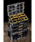 ToughSystem Tool Organizer 2.0 Full-Size with 10 Compartments and Long Tool Slot stacked and open on rugged terrain.
