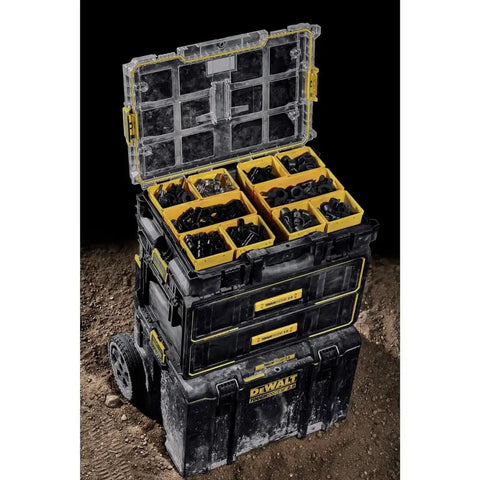 ToughSystem Tool Organizer 2.0 Full-Size with 10 Compartments and Long Tool Slot stacked and open on rugged terrain.