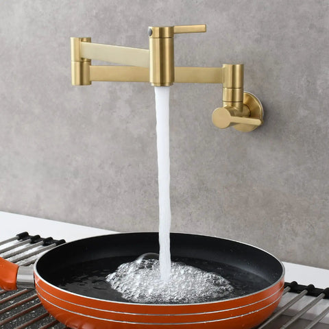 Brushed Gold Wall Mount Pot Filler Faucet With Folding Reach And Brass Construction Sixteen Point Seven Inch Extension