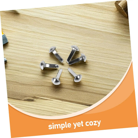 100 Pcs Iron Brads For Paper Crafting And Puppet Making Kit double leg fasteners shown on a wooden surface