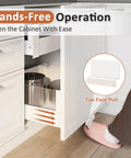 Foot operating Hands Free Cabinet Foot Pull for trash cans and doors, mounted under a full overlay cabinet, white finish.