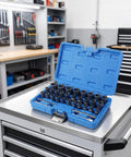 Top Tier 33 Piece Broken Bolt Extractor Set With Spiral Socket Nut Remover Kit For Cars And Trucks, CR-MO Steel Gear To Fix Rusty Bolts Fast In Your Garage Shop Or Workshop. blue case open on tool cart