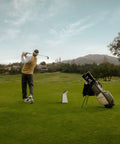 Golfer using Pro Grade Golf Launch Monitor And Simulator With 10 Inch Color Touchscreen Three Camera System More Than 15 Metrics GPS