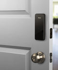 Touchscreen Smart Door Lock With Keypad And Bluetooth Motorized Deadbolt One Tap Entry Easy Setup Remote App Control See Who Entered And When 20 Unique Access Codes Black DB1 installed on a white door.