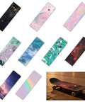 Colorful designs of Grippy Sandpaper Grip Tape for Skateboard Non Slip Matte Pad For Tricks And Grinds displayed with a skateboard.