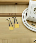 Get Your Hands On 30 Pcs Of High Voltage Microfarad Safety Capacitors With Built In Wire And Plastic Casing For Rock Solid Electrical Appliance Testing And Maintenance Work Without The Headache Or Risky Failures. Two yellow safety capacitors with wires on wood surface next to an electrical socket.
