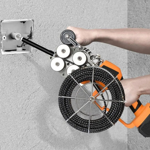 Cordless Brushless Electric Wire Puller 800W With 21V 4000mAh Battery, user demonstrating cable threading through a wall.