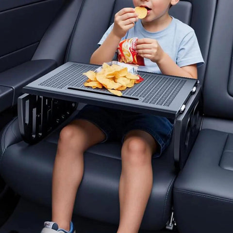 Child enjoying snacks on a Heavy Duty Foldable Car Tray For Tesla Cybertruck Steering Wheel Hook Snack Holder Laptop Stand.