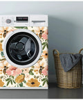 Vintage Boho Floral Peel And Stick Wallpaper With Peonies In Rose Beige Pink And Olive on washing machine next to basket