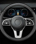 Premium Microfiber Leather Steering Wheel Cover With Anti Slip Padding And Matte Carbon Trim For Solid Daily Driving Universal 14.5 Inch Black ride gear shown on steering wheel.