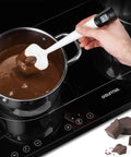 Instant Read Candy Thermometer Spatula With Built In Digital Temperature Reader measuring chocolate in pot