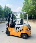 Heavy Duty Electric Forklift Truck Rolled Out As A Straight Shooter Warehouse Workhorse For Narrow Aisles And Heavy Cargo Hauling With No Hassle Counterbalance Lifting Power, side view on a tree-lined street.