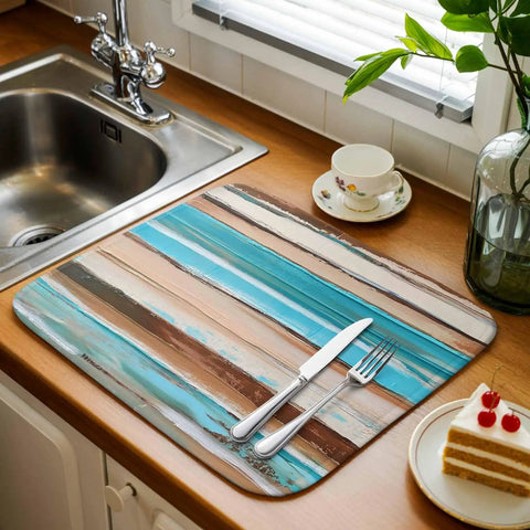 Go To Absorbent Dish Drying Mat 16 By 18 Inches in vintage wood grain with blue brown white finish on kitchen counter with cutlery