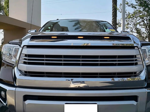Smoked Lens Amber LED Grille Lights Kit For 2014 To 2021 Toyota Tundra Center Set installed on vehicle grille.