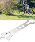 Stainless Steel Bottom Bracket Wrench For Bikes Multifunctional BB Removal And Installation Tool in front of blurred cyclist background